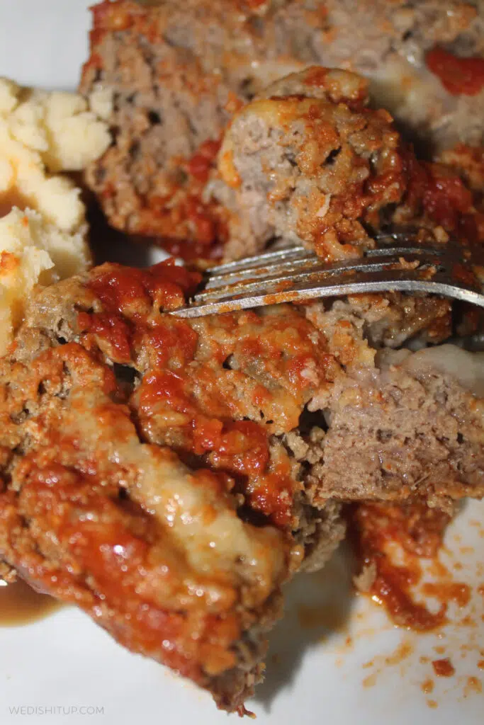 amazing stuffed meatloaf with fork