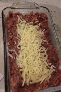 amazing stuffed meatloaf after putting in the cheese