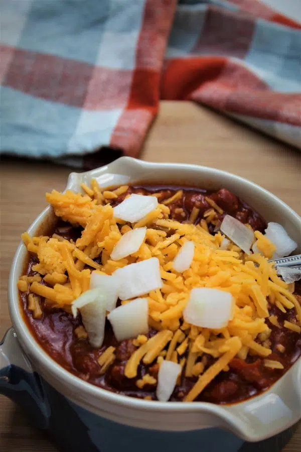Chili top view with cheese and onions